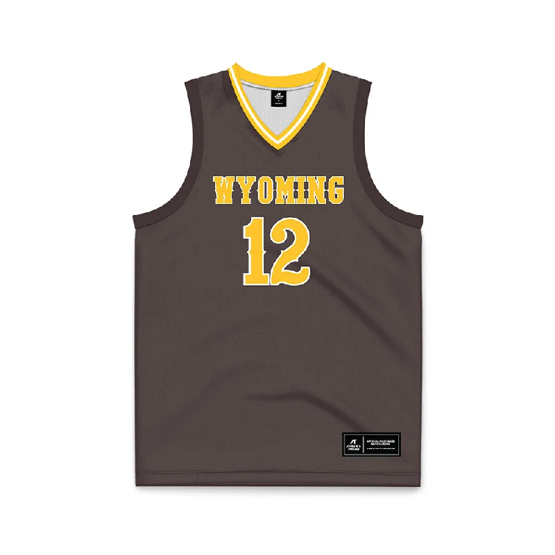 Wyoming - NCAA Women's Basketball : Malene Pedersen - Brown Basketball Jersey Pink Jersey Tee